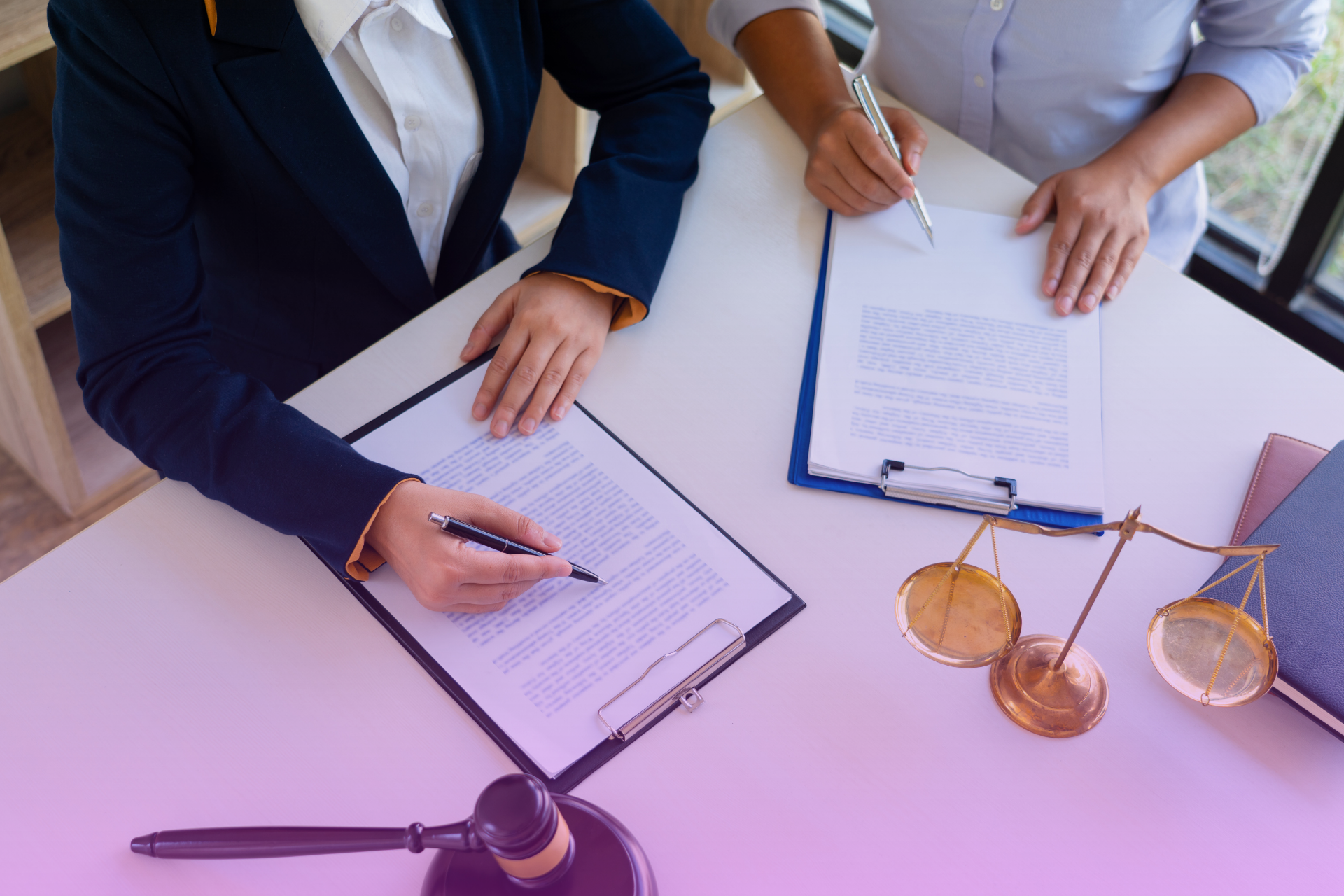 Close-up of legal will documents and a gavel on a desk