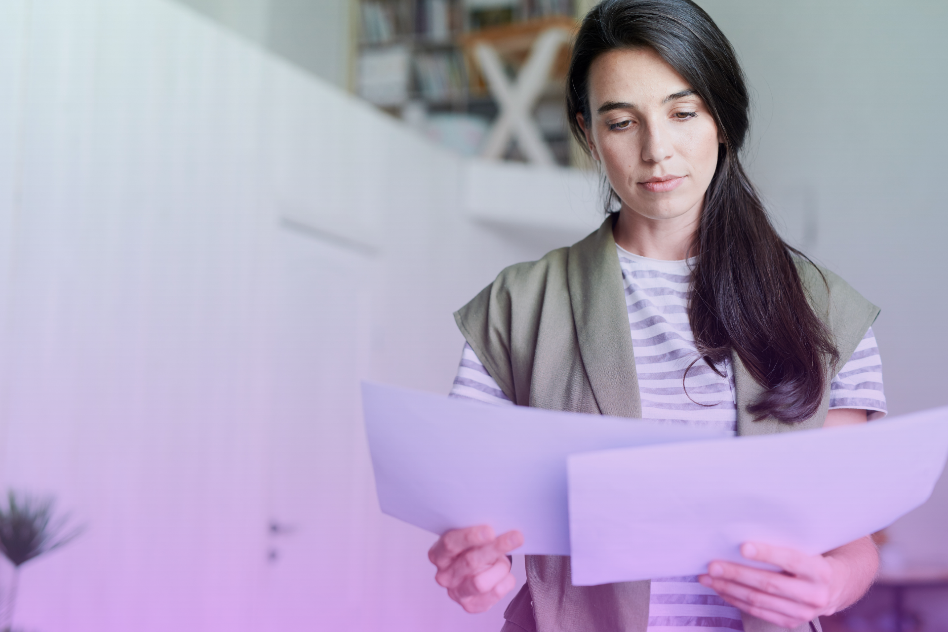 Woman looking concerned while reviewing estate planning documents