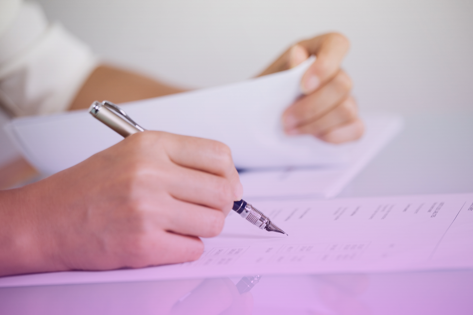 A person looking confused or overwhelmed while holding a stack of legal paperwork, representing the complexity of DIY legal work.