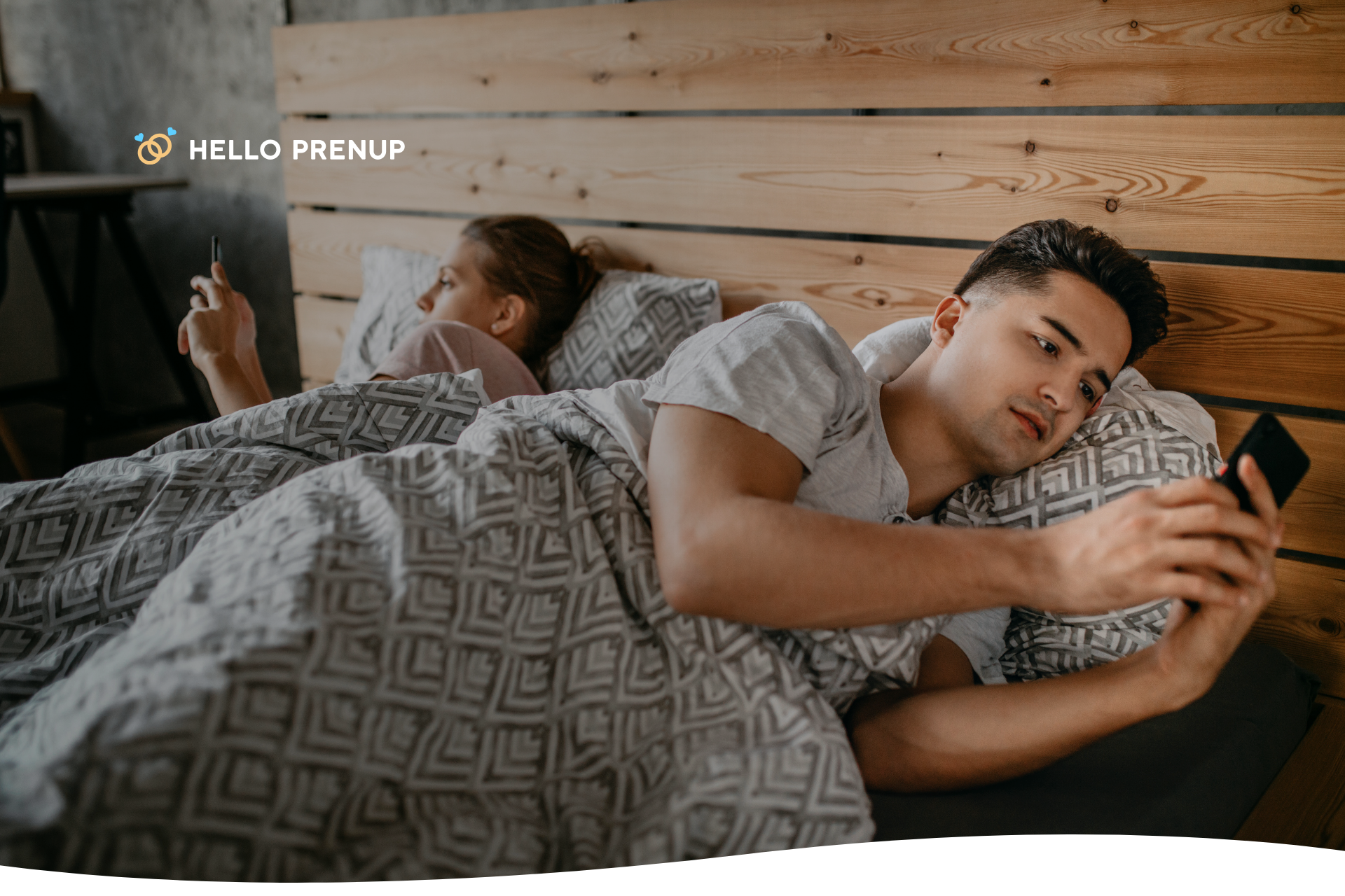 A couple sitting on a couch, facing slightly away from each other, symbolizing emotional distance or tension.