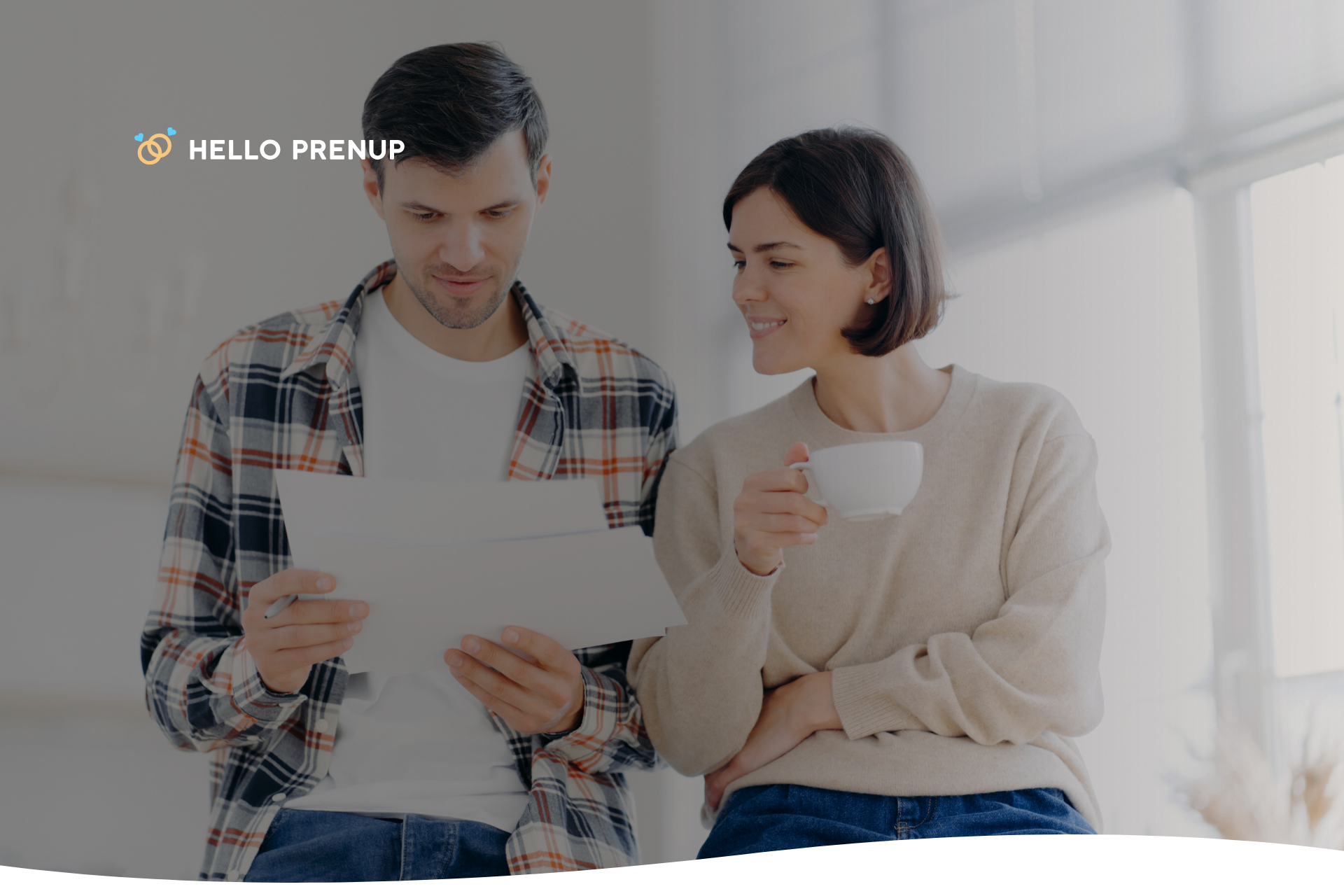 A serious couple sitting across from each other at a table, discussing a legal document, potentially about the termination of their postnuptial agreement.