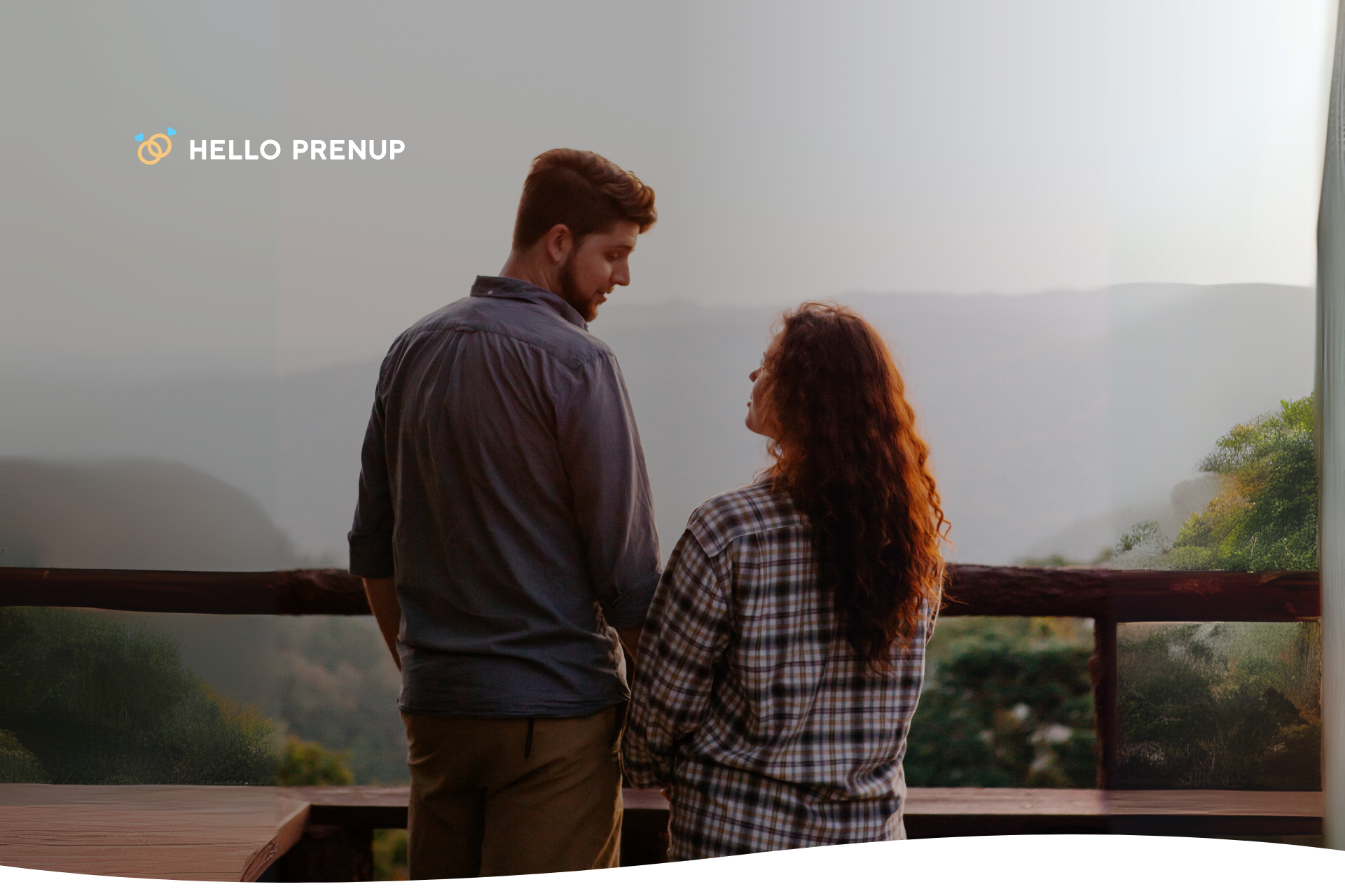 A happy couple smiling with a scenic New Hampshire mountain landscape in the background, representing a secure future in the state.