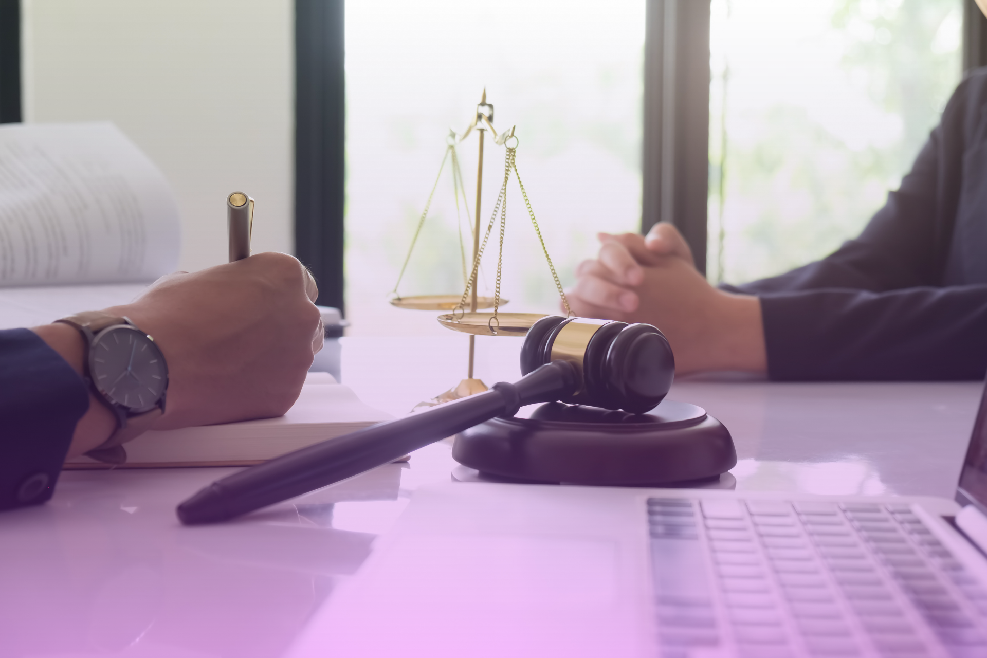 A signed legal document, possibly a prenuptial agreement, resting on a table next to a judge's gavel, signifying legal approval and enforcement.