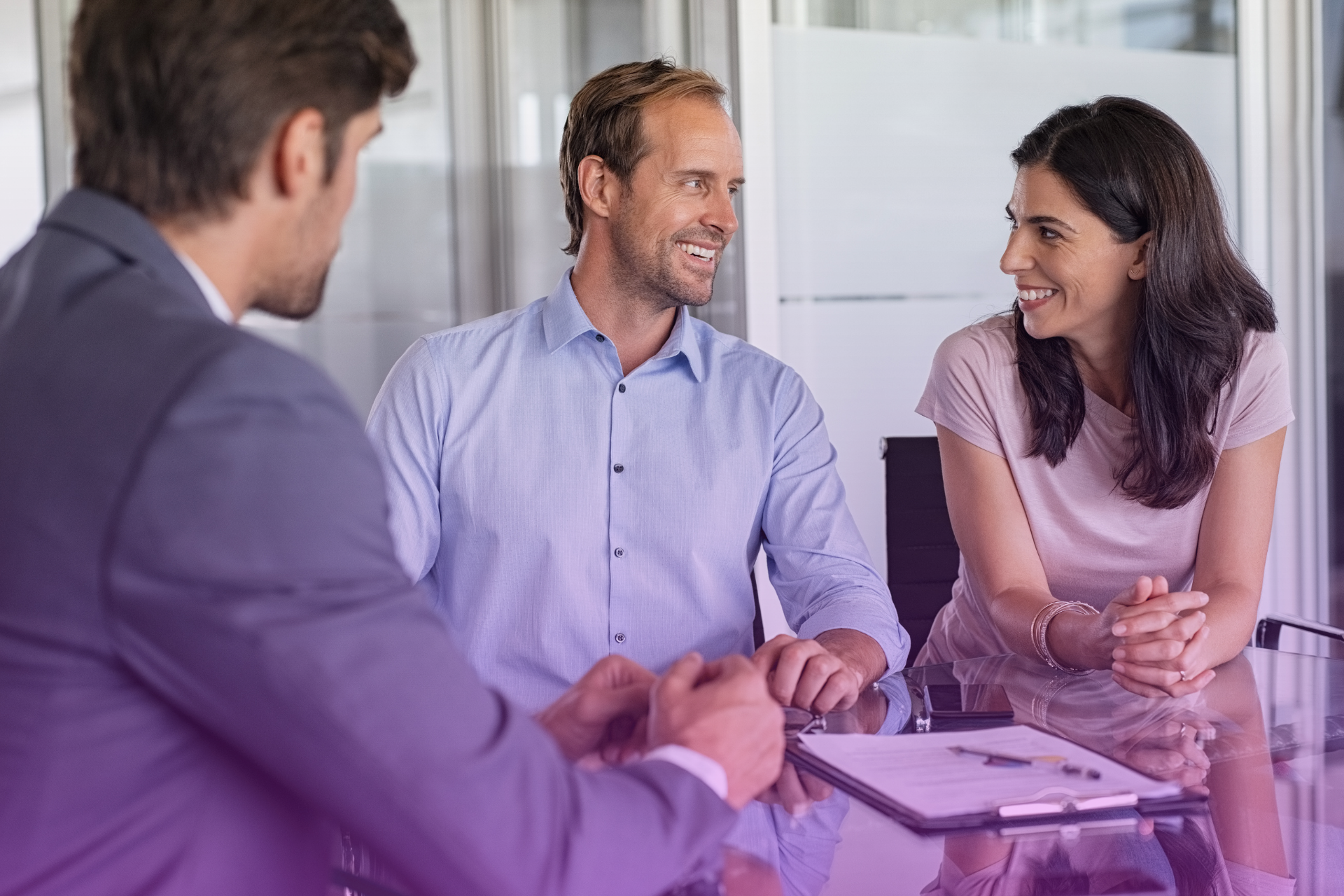 A couple meeting with a lawyer to review documents