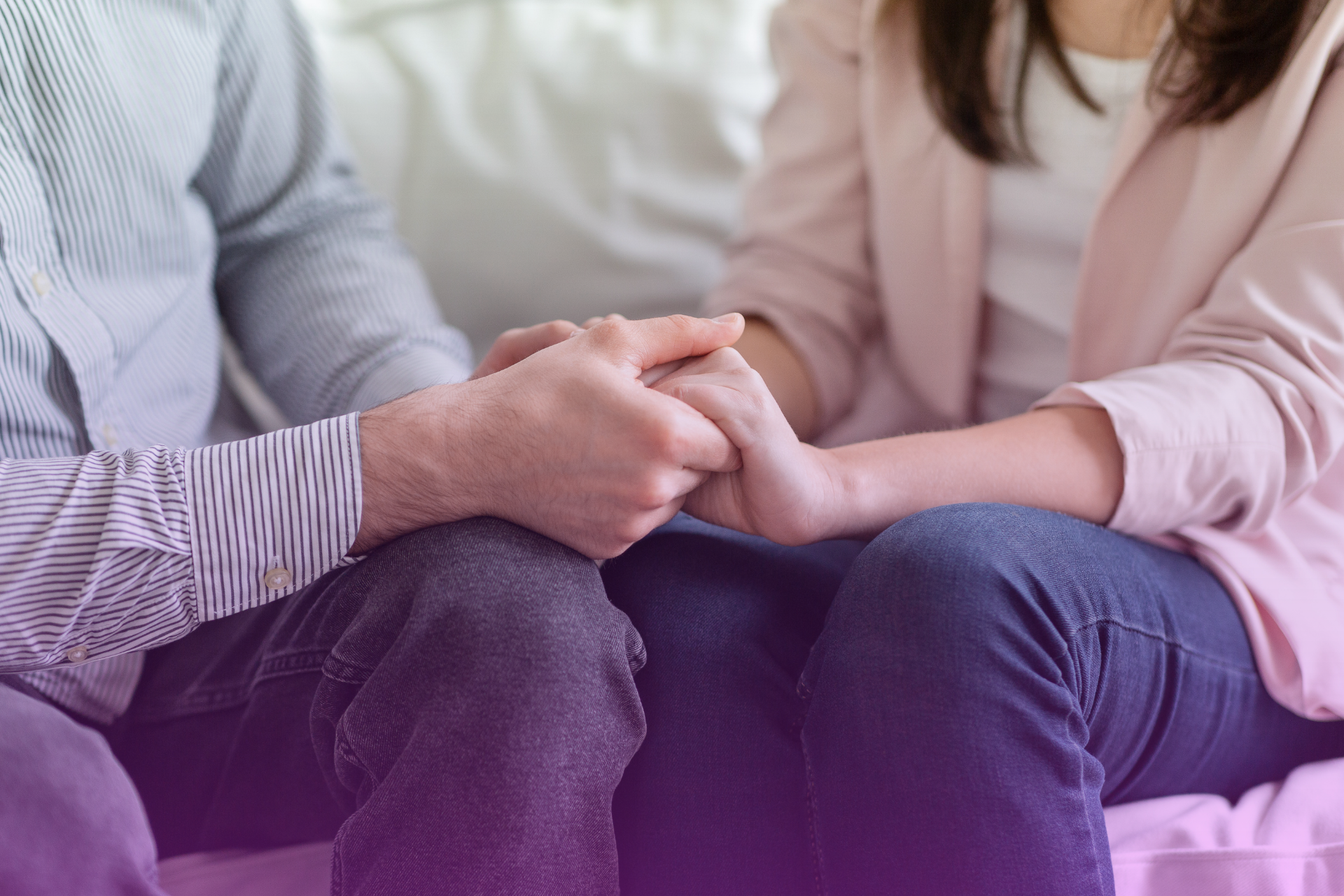 Couple holding hands after an emotional conversation