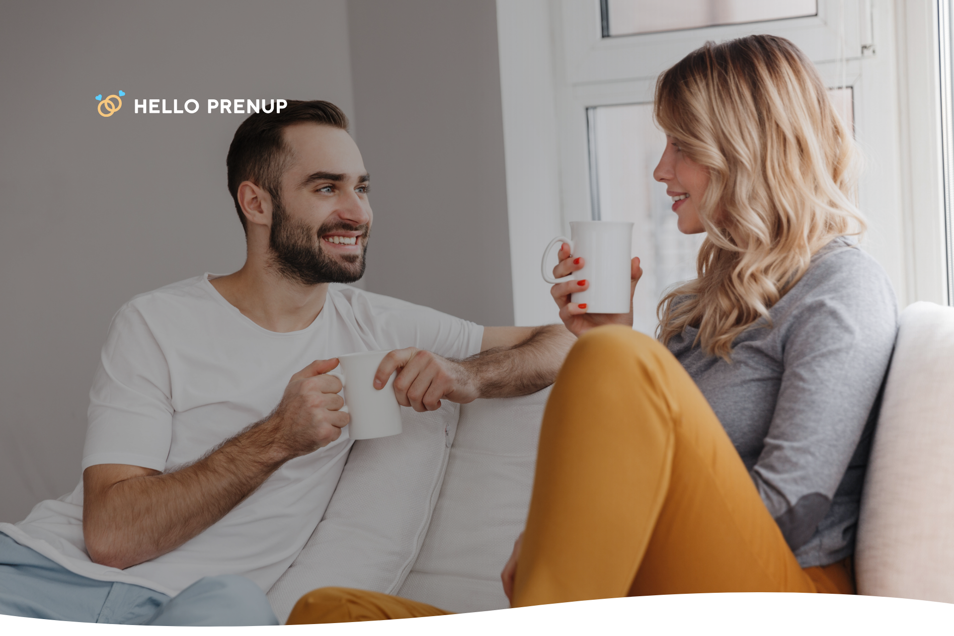 A couple sitting closely on a couch, engaged in a deep and earnest conversation, symbolizing open communication.