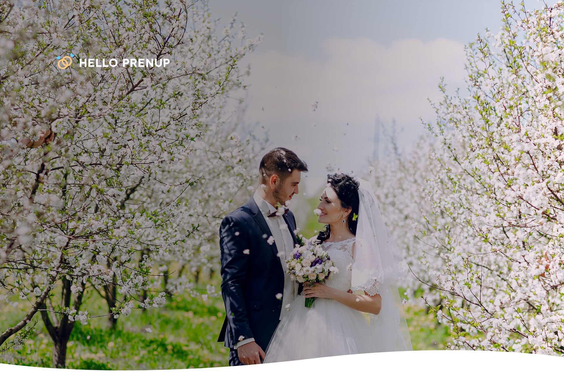 A couple getting married in a lush spring garden, showcasing the beauty of a spring wedding.