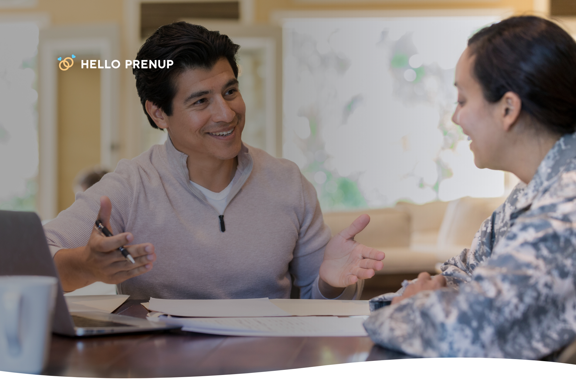 A couple at a table reviewing a legal document, with blurred figures of children playing in the background, subtly indicating the purpose of the agreement.