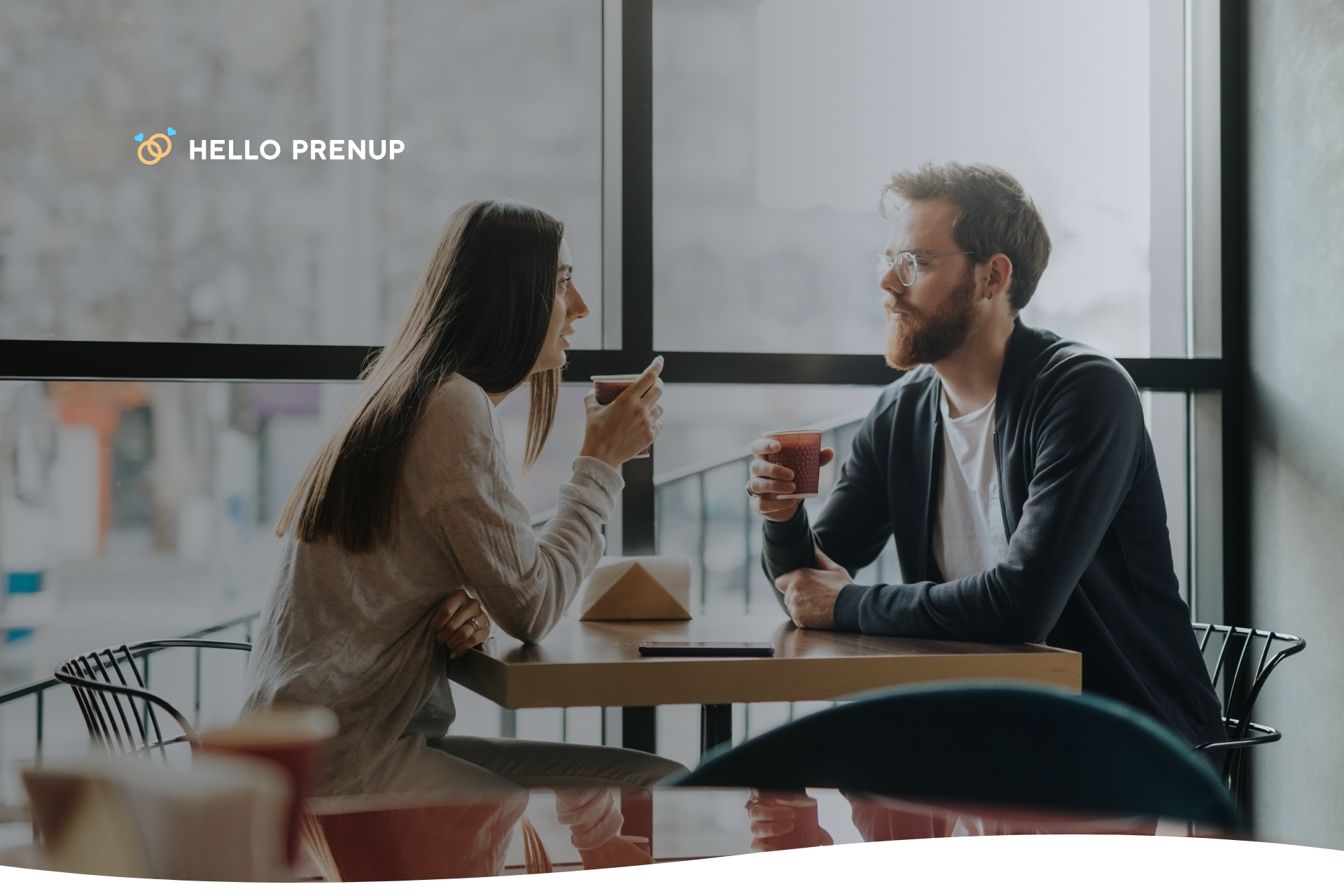 A couple engaged in a calm and open conversation over coffee, symbolizing healthy financial discussions.