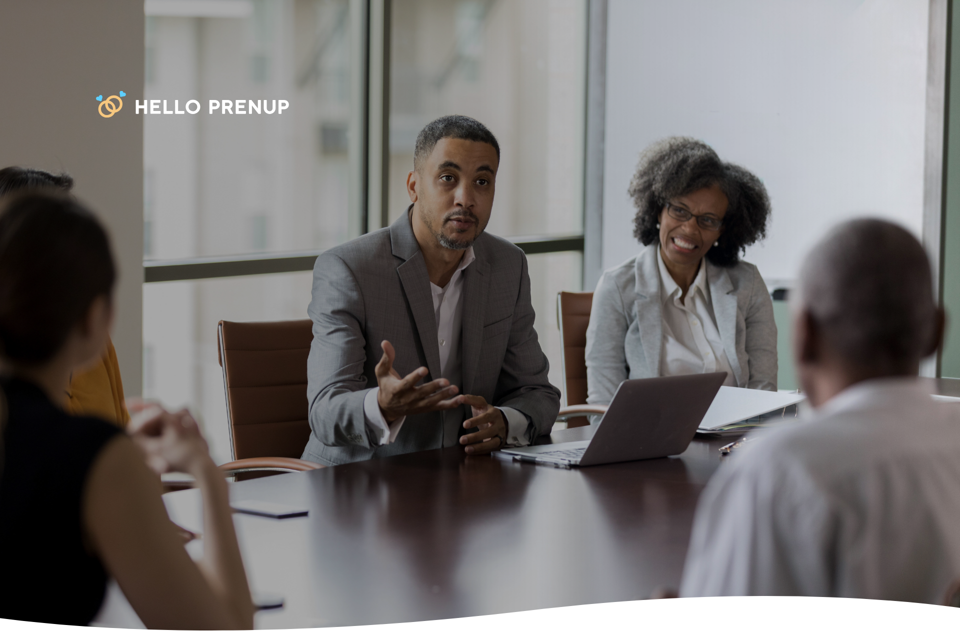 A family sitting around a white table, engaged in a serious but constructive conversation.