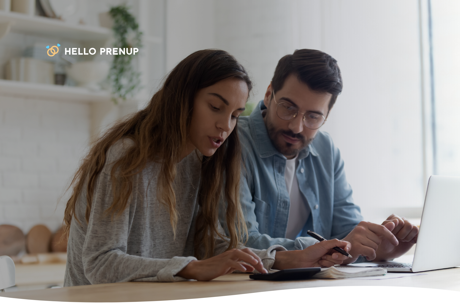A husband and wife sitting at a table, looking thoughtfully at legal documents, engaged in a serious discussion.