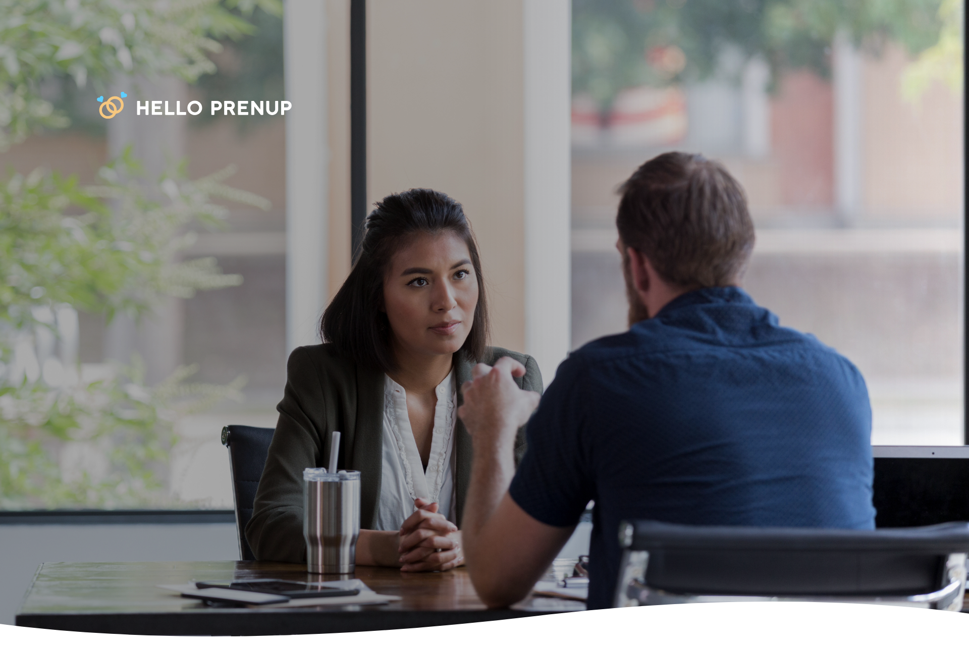 A close-up of a person nodding slightly and making eye contact, demonstrating active and non-defensive listening.