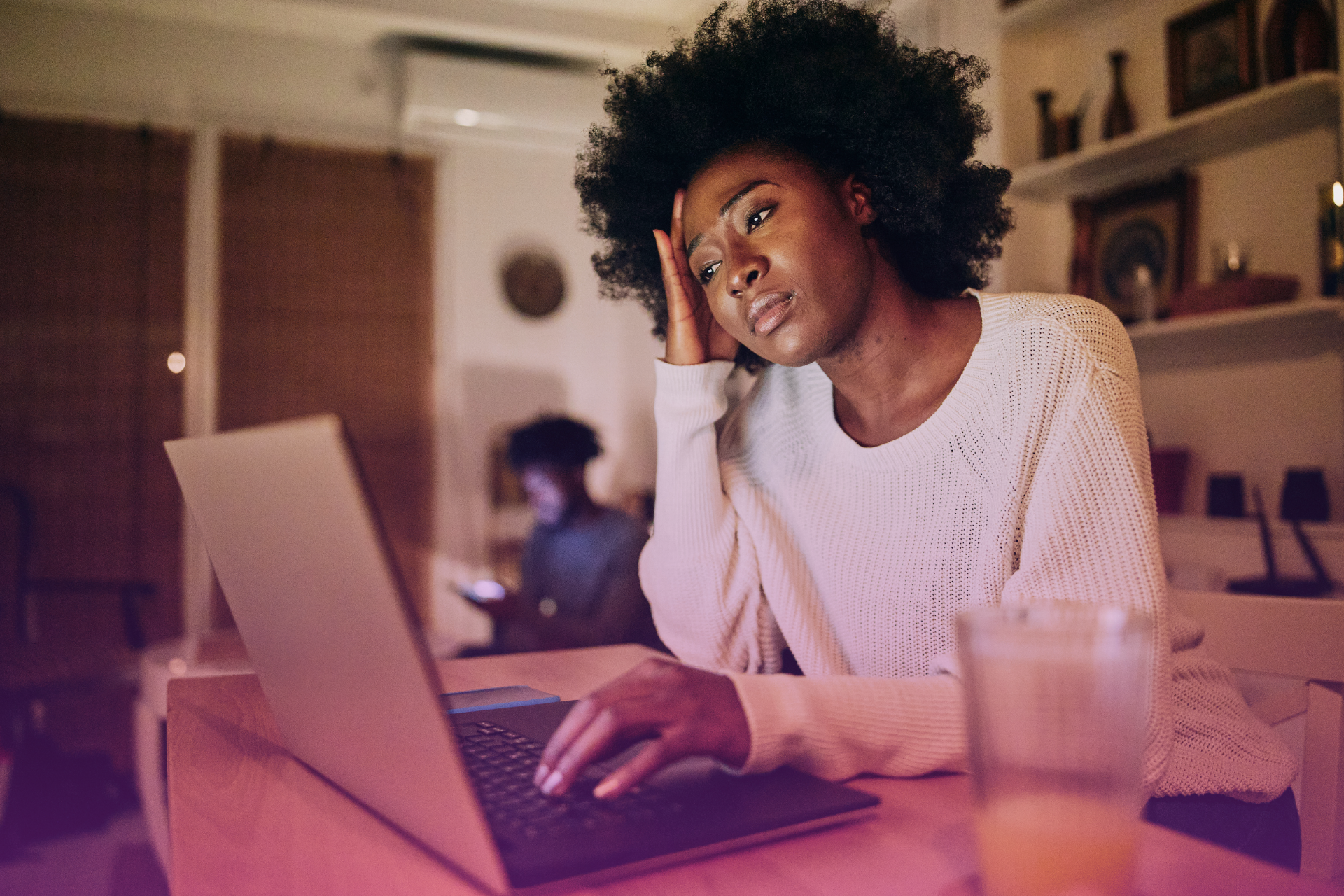 A person looking frustrated while trying to fit together money-themed puzzle pieces, symbolizing challenges with financial management.