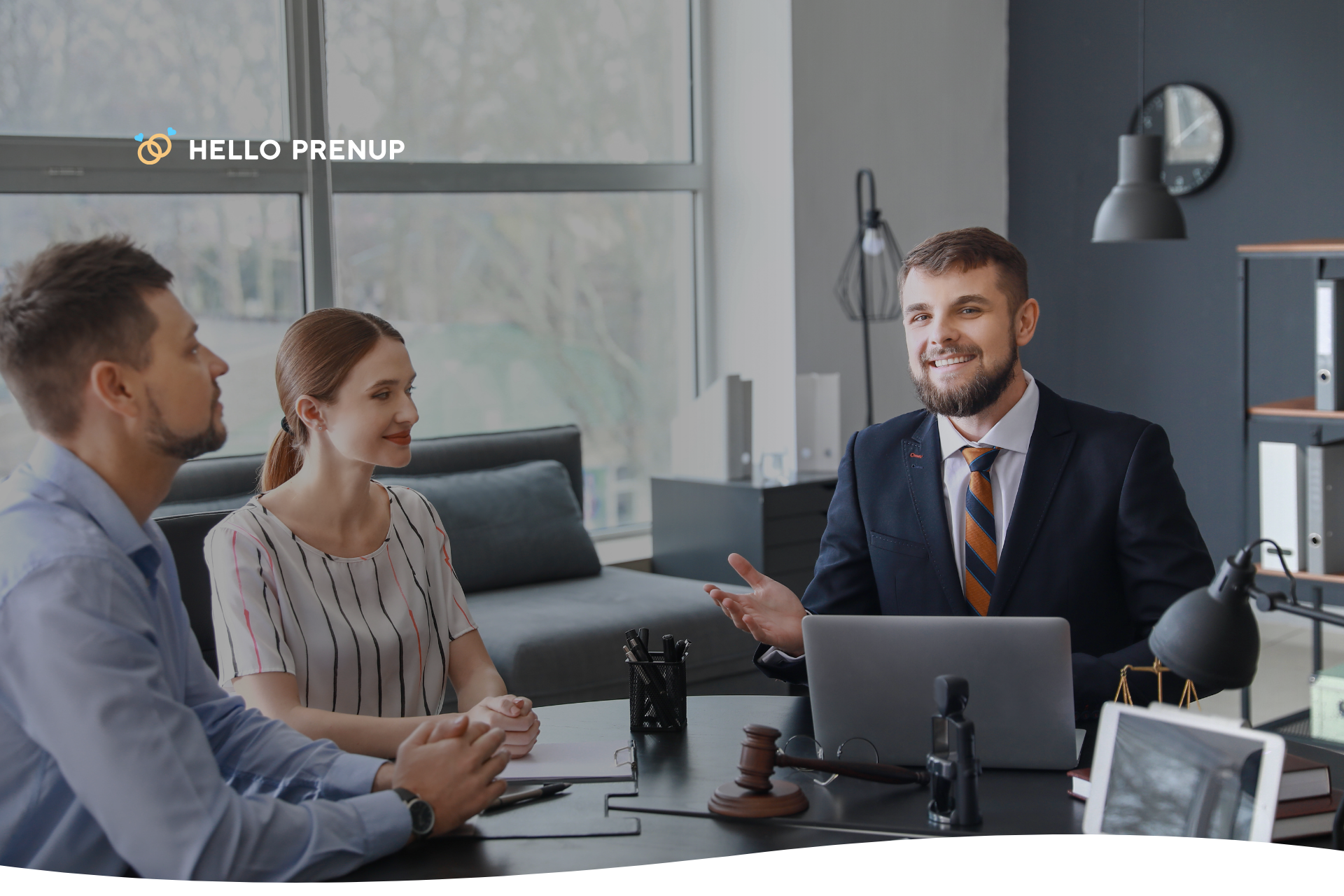 a couple sitting in a lawyer’s office, talking to their attorney A couple sits calmly in a professional office, discussing their prenuptial agreement with their lawyer.