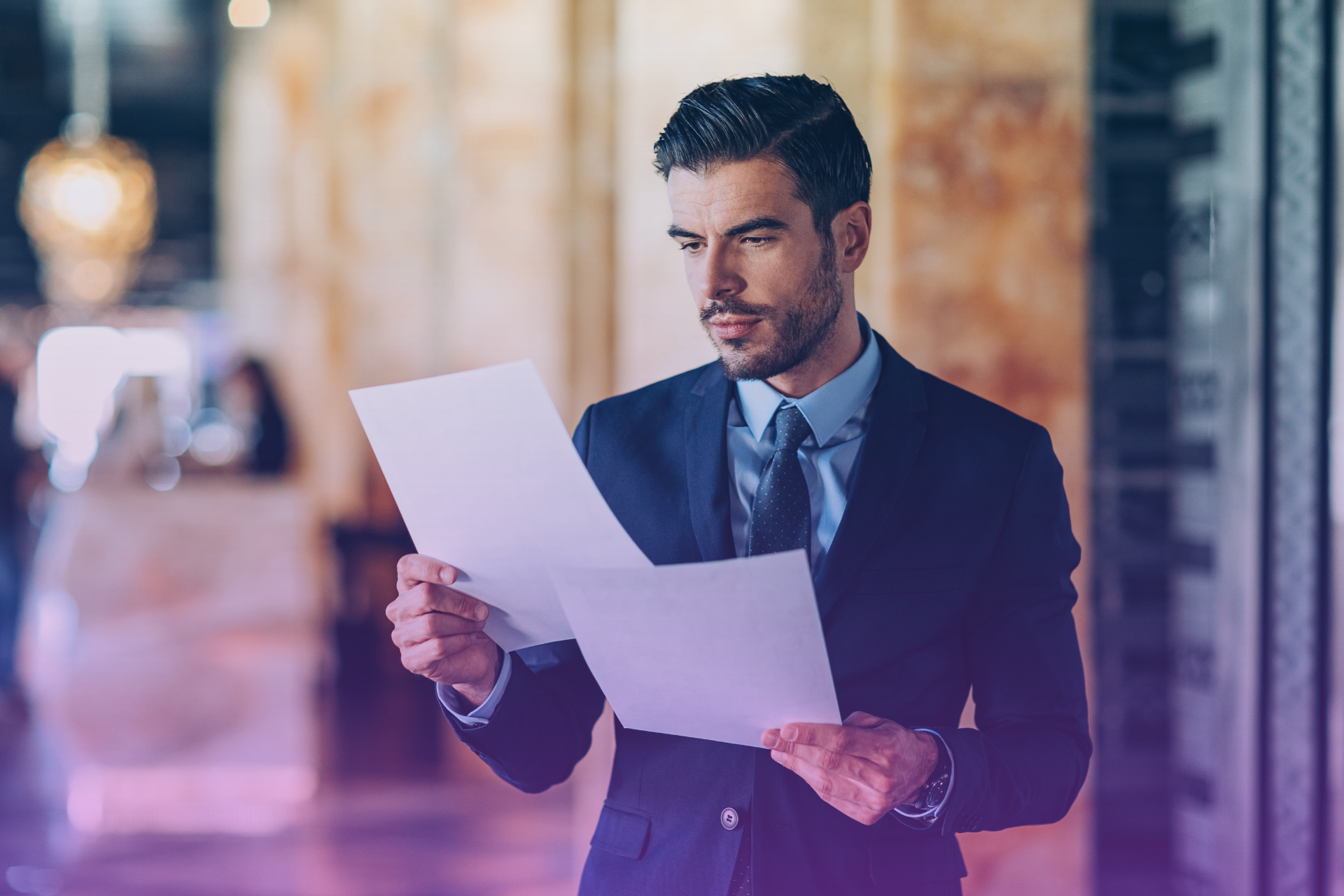 A person looks over a prenuptial agreement with a serious expression, representing the need to fully understand the document before signing.