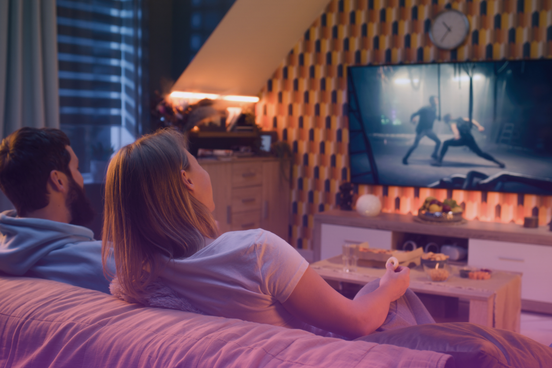 A couple smiling and actively engaging in a fun, shared hobby, demonstrating healthy ways to de-stress together.