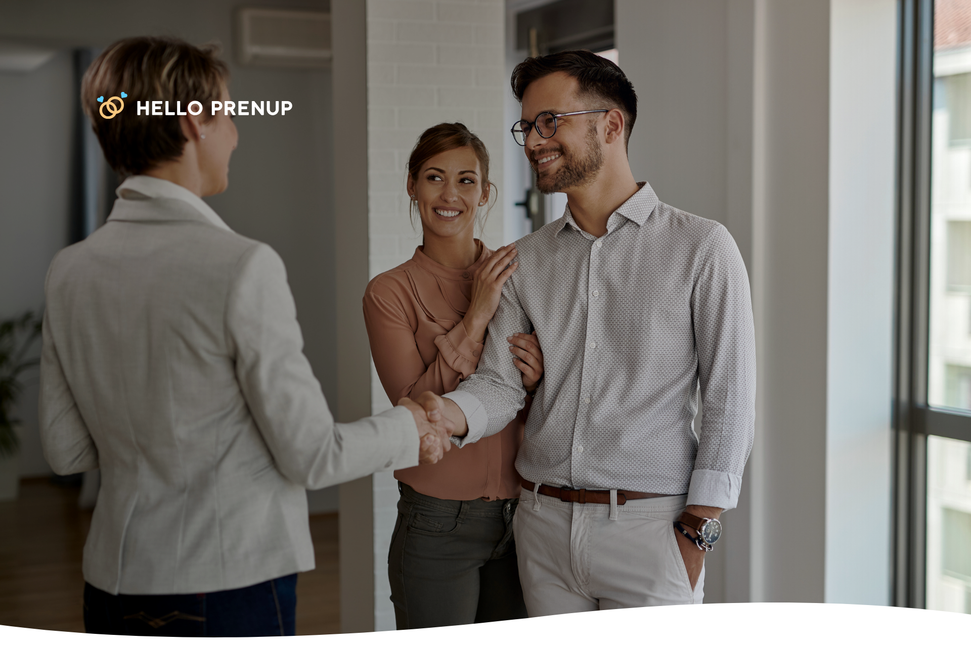 A couple shakes hands with a legal professional, symbolizing their agreement and the value of professional guidance.