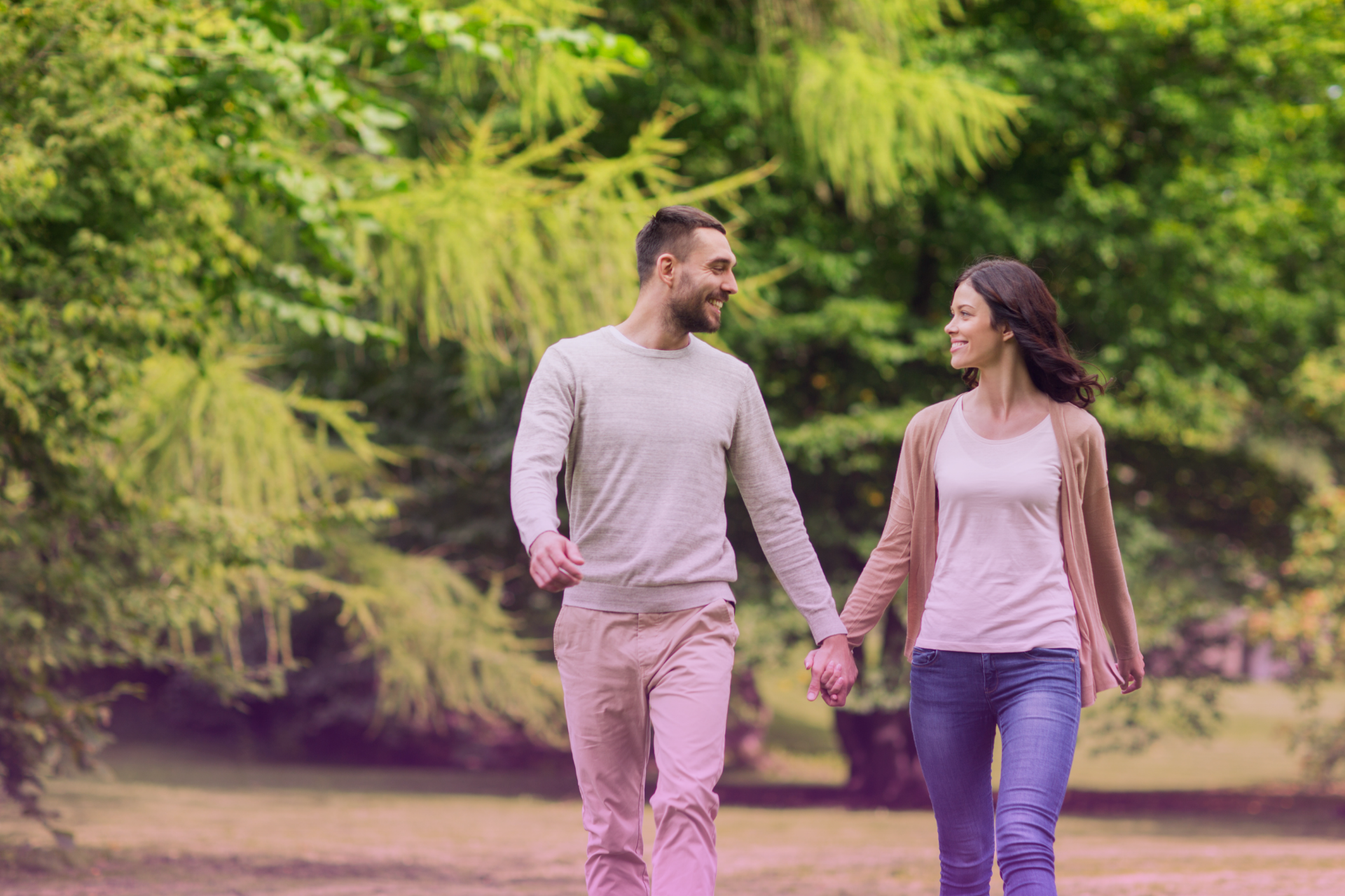 A couple holding hands and walking together, with confident smiles, symbolizing a successful, harmonious relationship built on understanding.