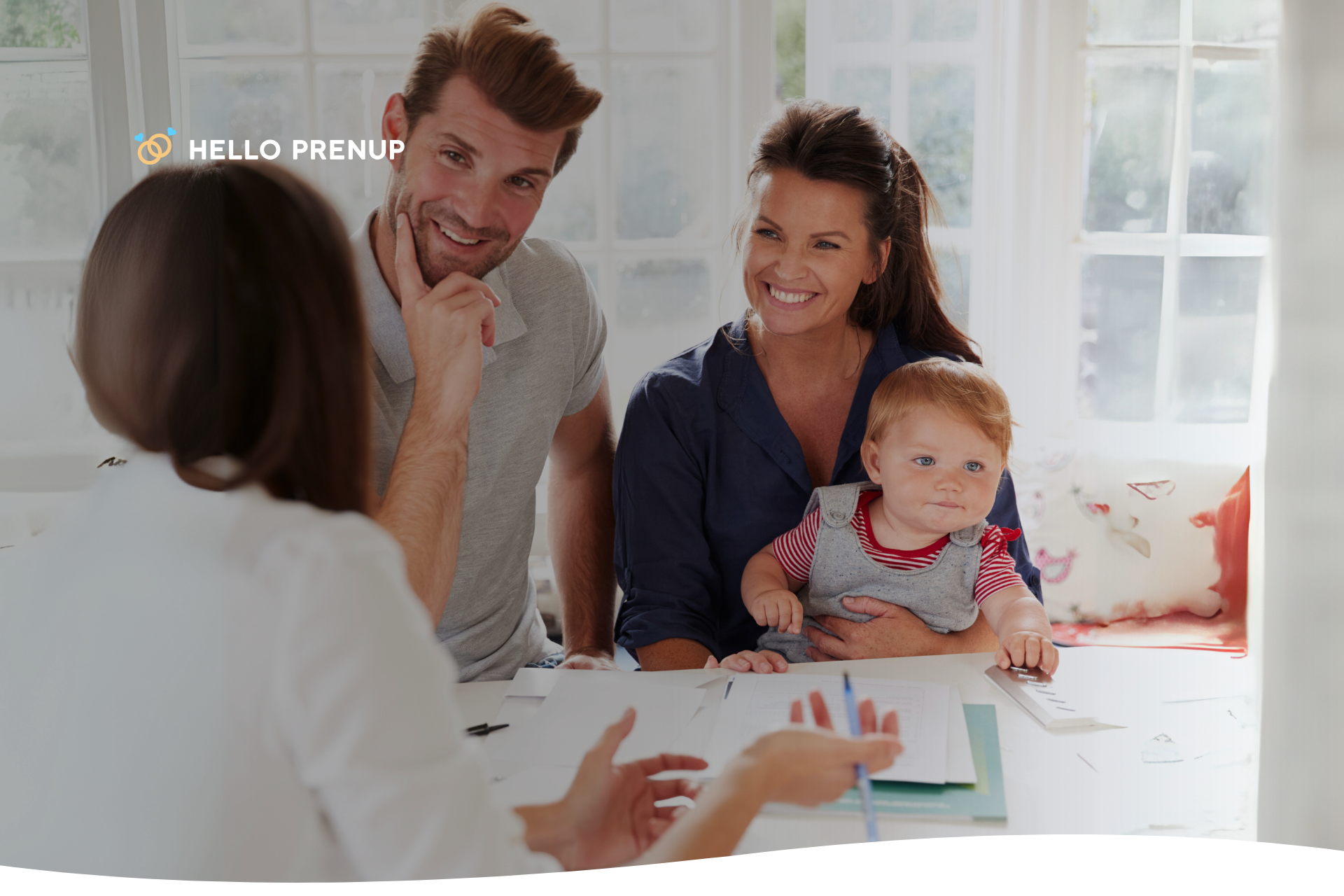 A family sitting together and reviewing legal or financial documents, symbolizing multi-generational planning.
