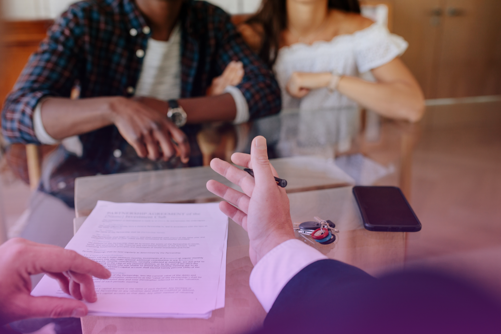 A lawyer clearly explaining complex legal terms and requirements to a couple, highlighting the importance of expert guidance for Tennessee prenups.