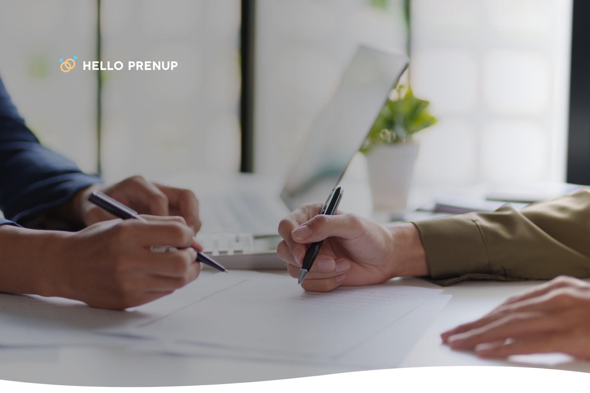 Two individuals signing a legal document with a pen, symbolizing the formal, voluntary execution of their prenup.
