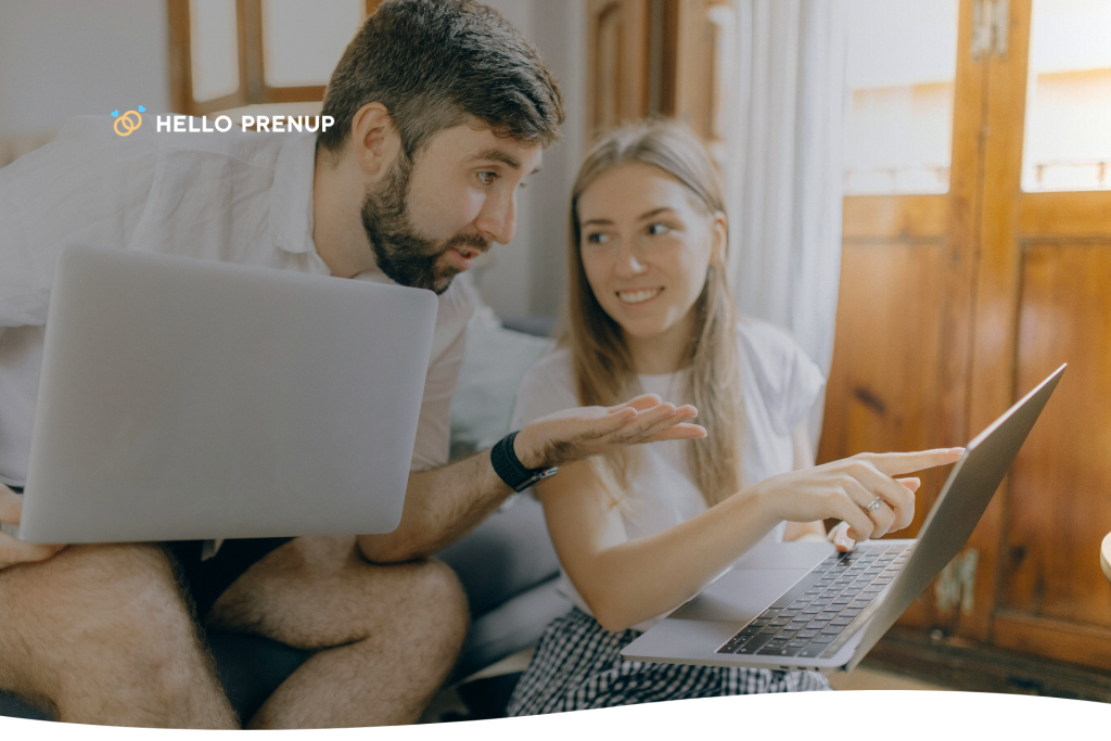 Washington couple smiling while reviewing a prenup document on a laptop screen