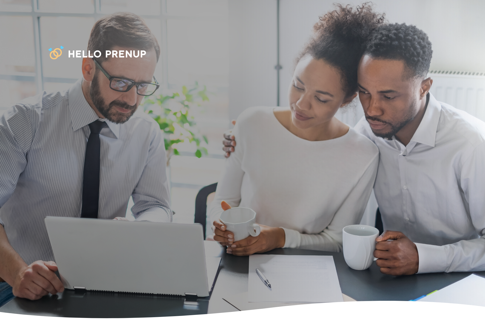 A couple is sitting with their lawyer, having a serious and professional discussion about a legal document, such as a power of attorney.