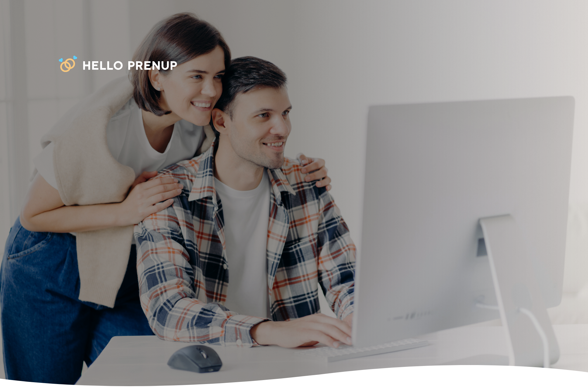 A couple looks at a checklist of prenup requirements on a laptop, symbolizing a proactive and organized approach.