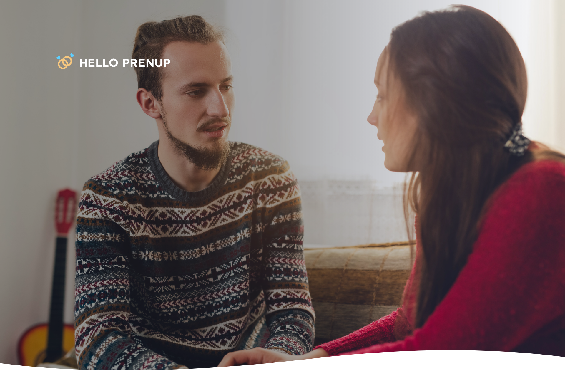 A couple looks at each other while having a serious but calm discussion, representing the effort to communicate and resolve underlying issues.