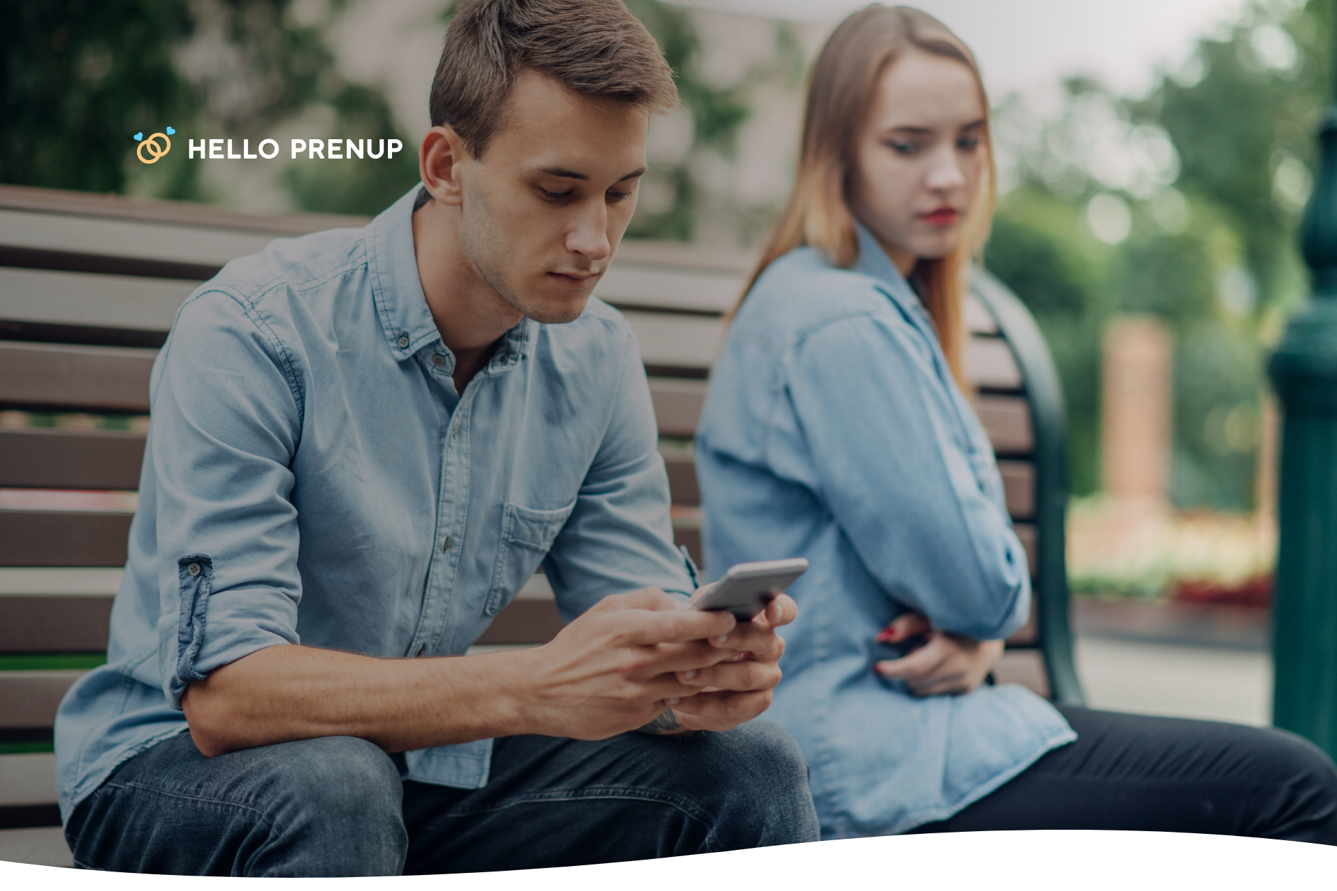 A person is looking at their phone while their partner tries to get their attention, symbolizing a "turn away" from a bid for connection.