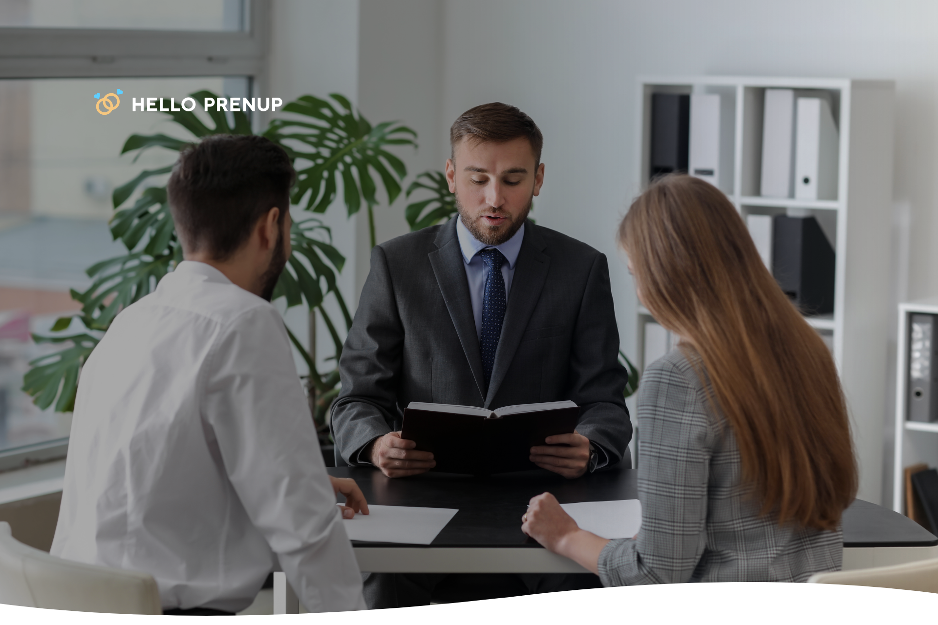 a couple at a table, discussing legal papers