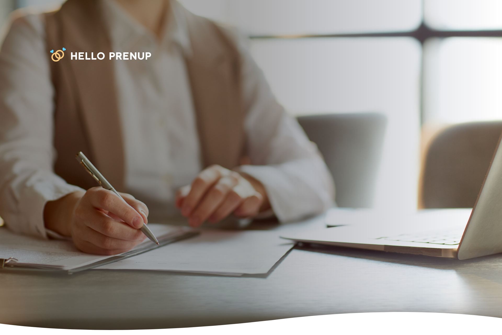 A person is signing a legal document with a pen, representing the final step in establishing a trust to protect assets.