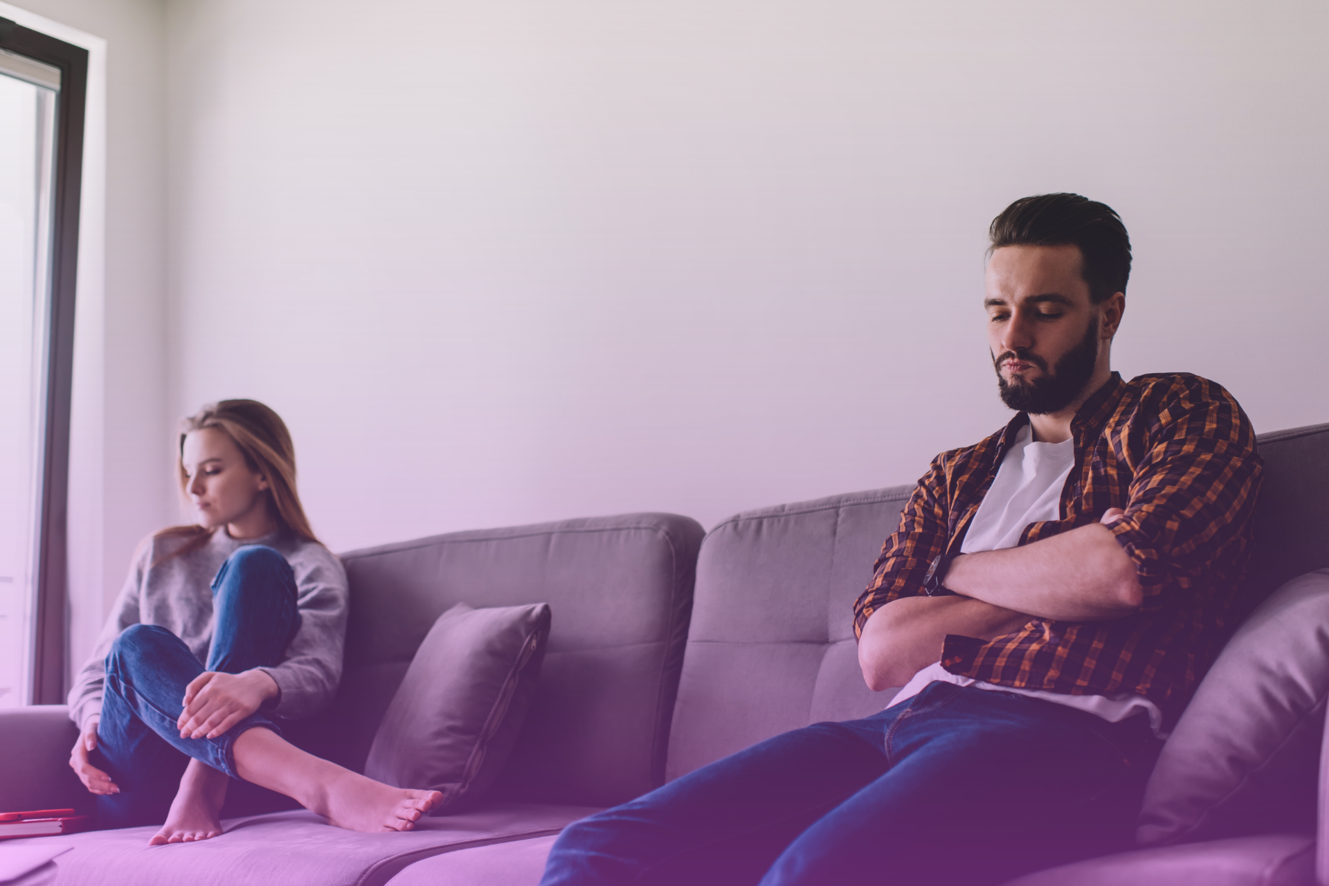 A person sits calmly, feeling supported by their partner in a quiet, peaceful moment, symbolizing a moment of reconnection.