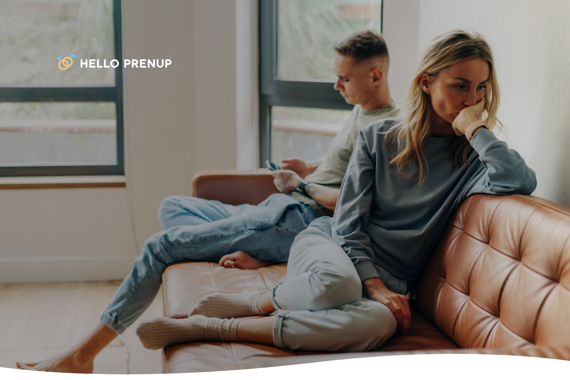 A person sits alone, taking a deep breath, symbolizing the importance of self-care and grounding during a stressful moment.