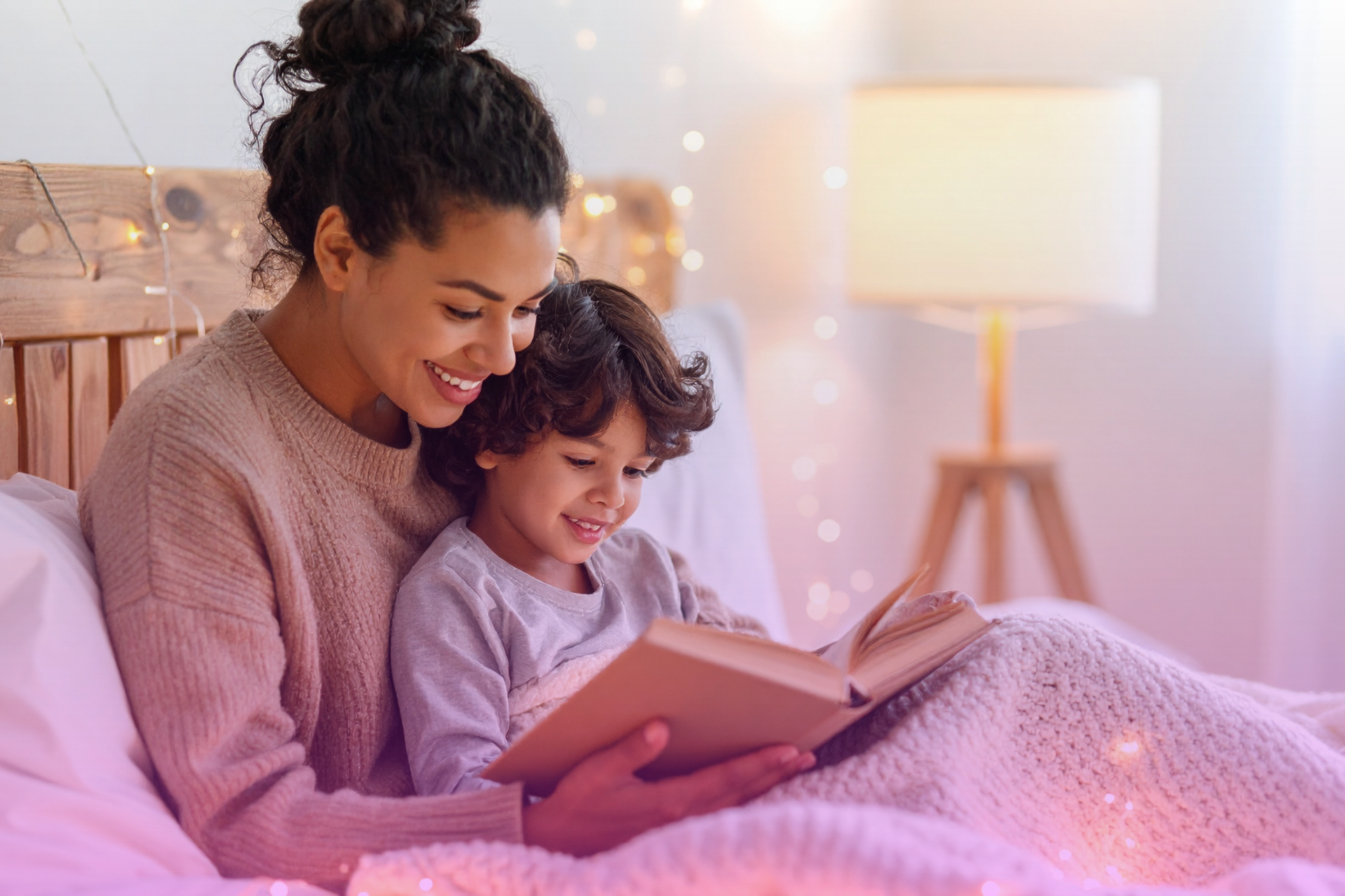 A person reading a book with their biological child while their partner reads with their own child nearby, symbolizing the importance of respecting existing parent-child bonds.