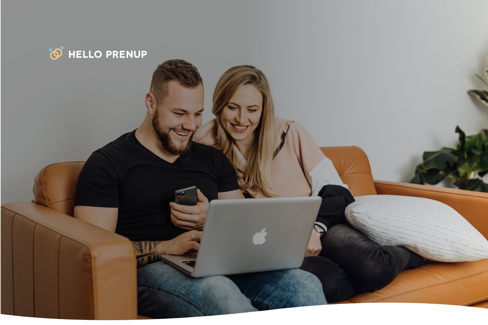 Couple sitting on a couch discussing their financial values and goals