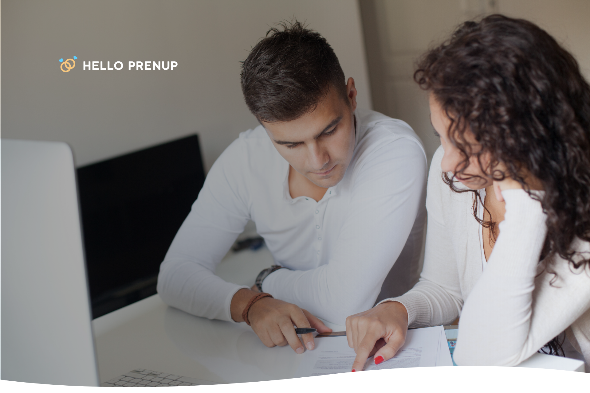 financial_planning_couple_coffee_table Couple sitting at a coffee table with laptop and papers, planning finances