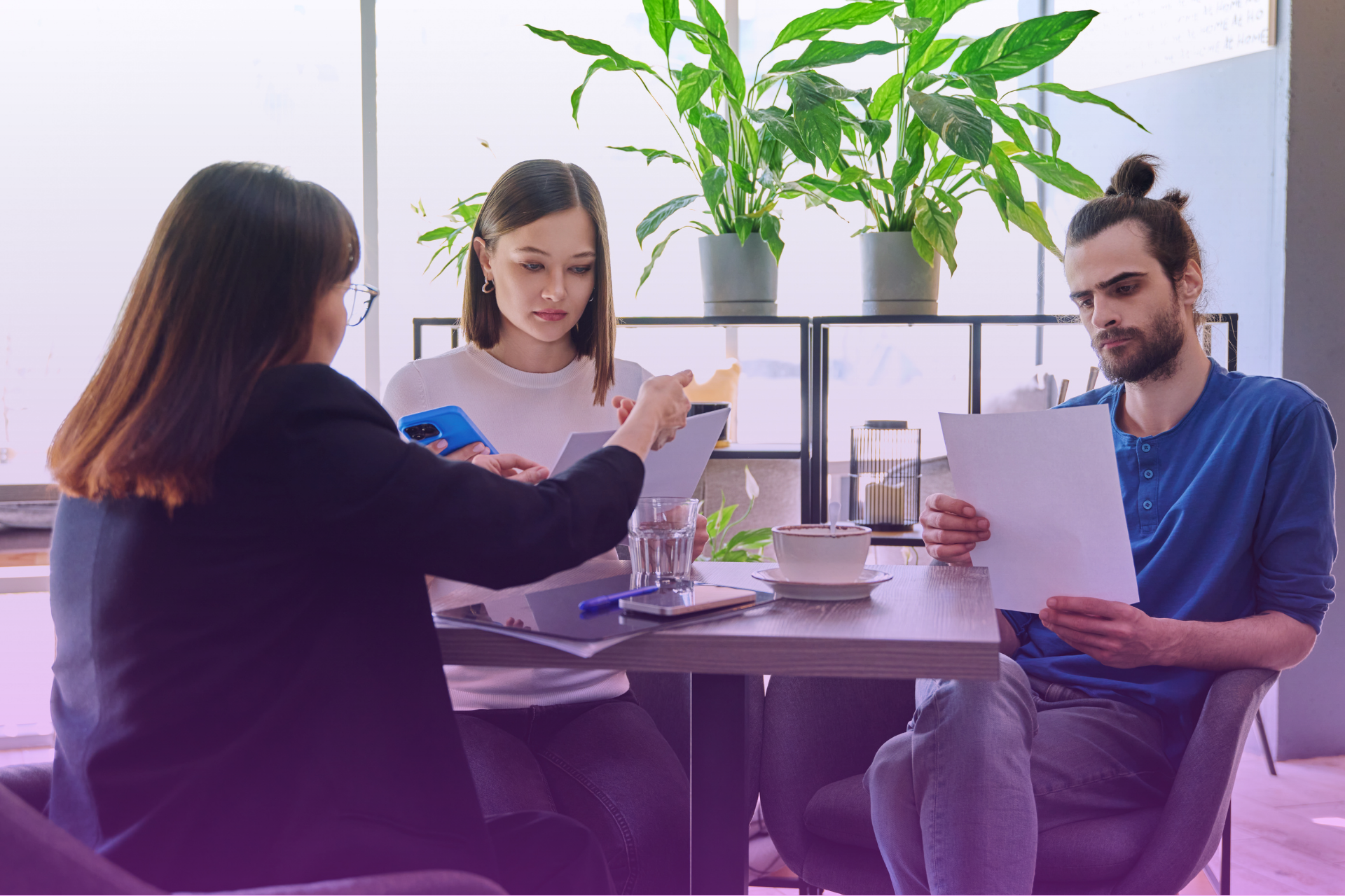 Married couple reading and discussing the terms of a postnup agreement together