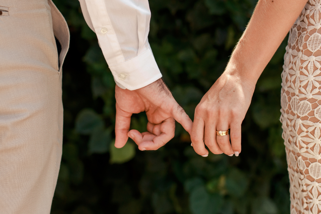 Washington married couple holding hands while talking through how property would be divided in a divorce