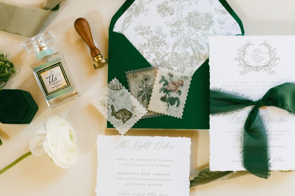 A close-up of wedding invitations with stylish fonts, paper textures, and decorative elements arranged for presentation