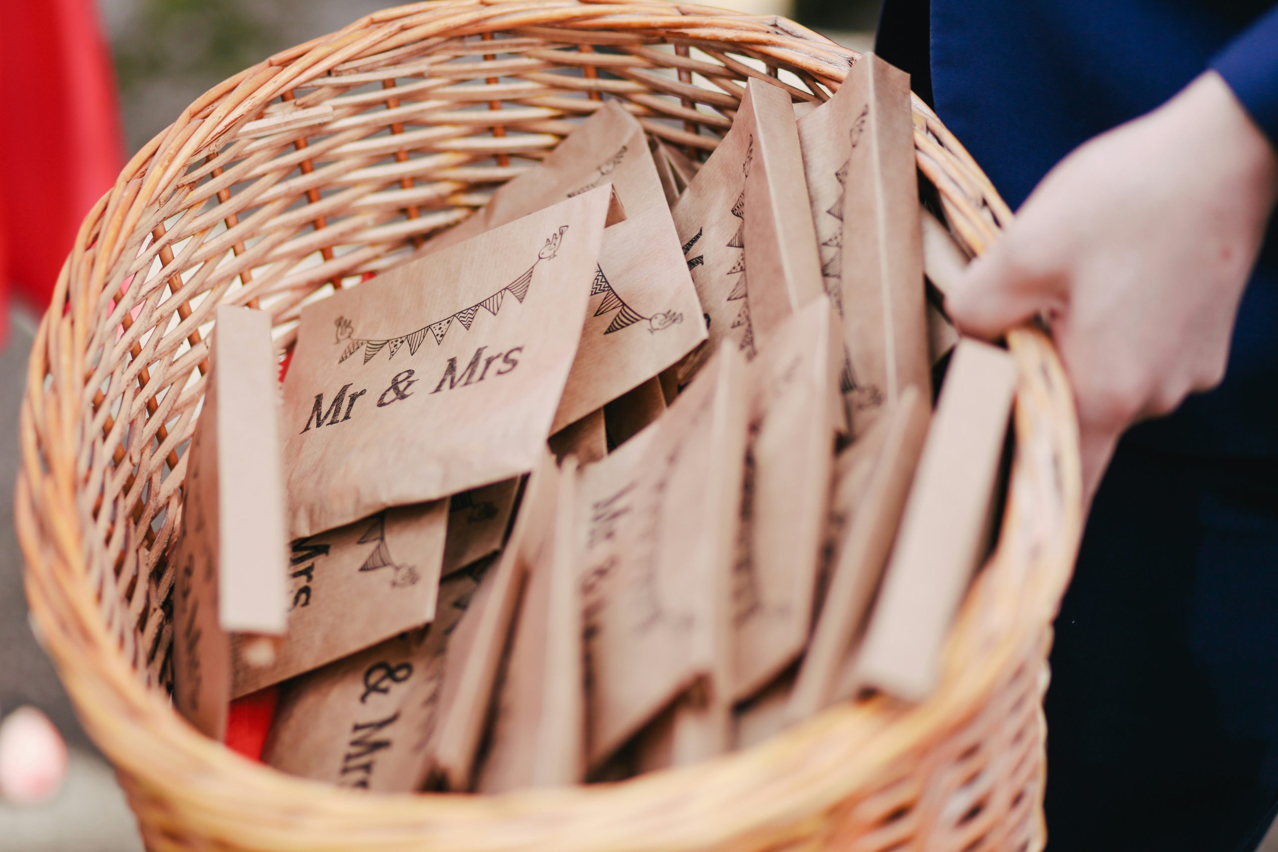 A table arranged with wedding favors for guests, featuring small gifts neatly presented as part of the reception decor