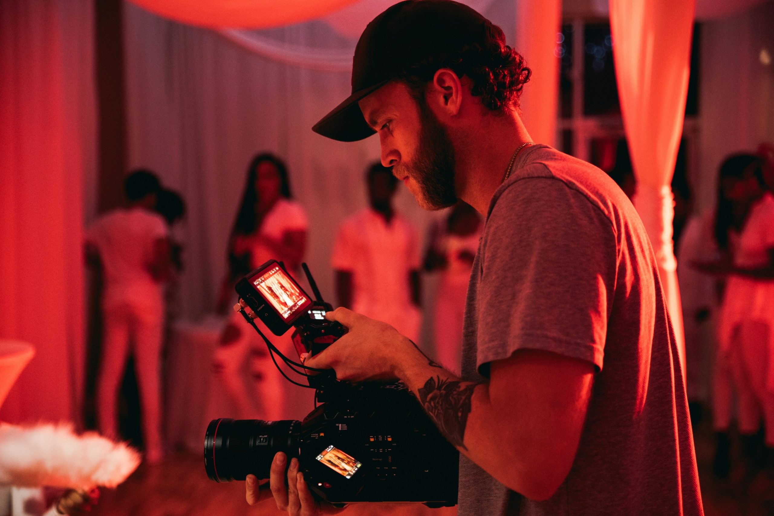 Videographer capturing wedding footage of the couple