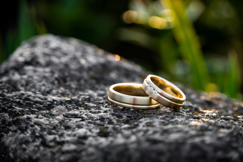 A detailed shot of wedding bands arranged elegantly, highlighting their design and significance