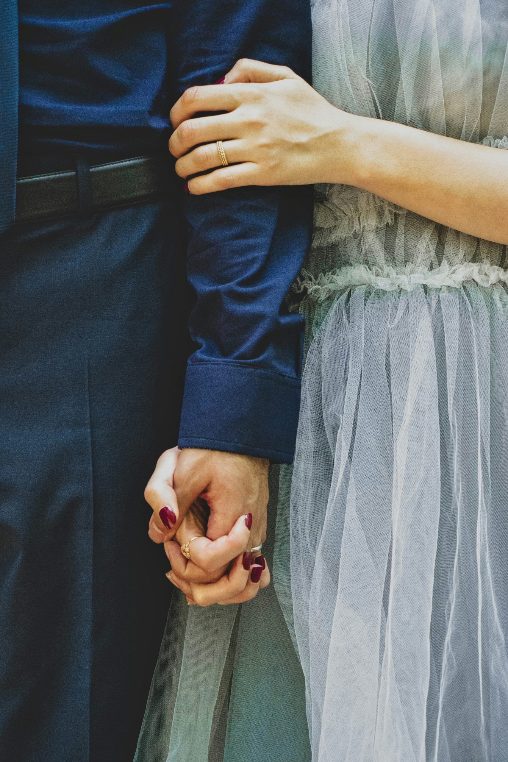 Alabama bride and groom holding hands on their wedding day
