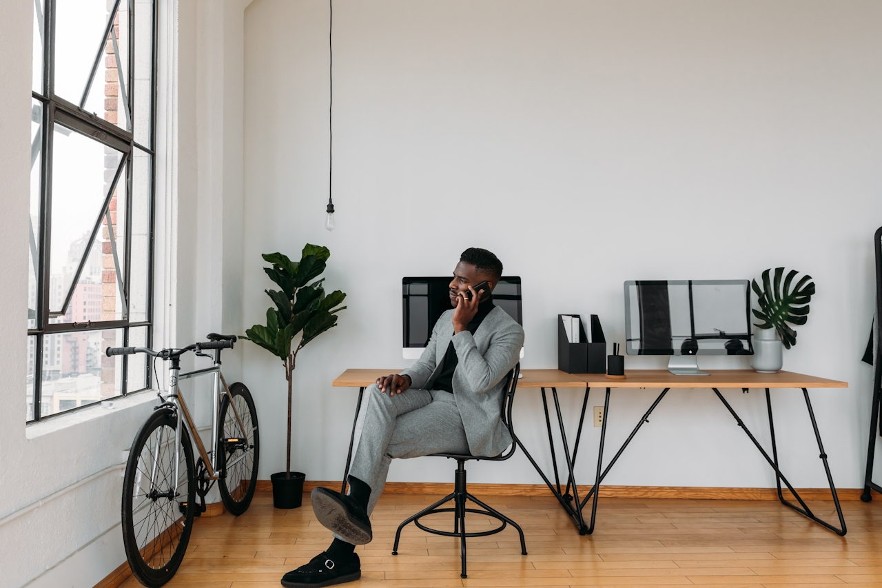 Man on cellphone in home office