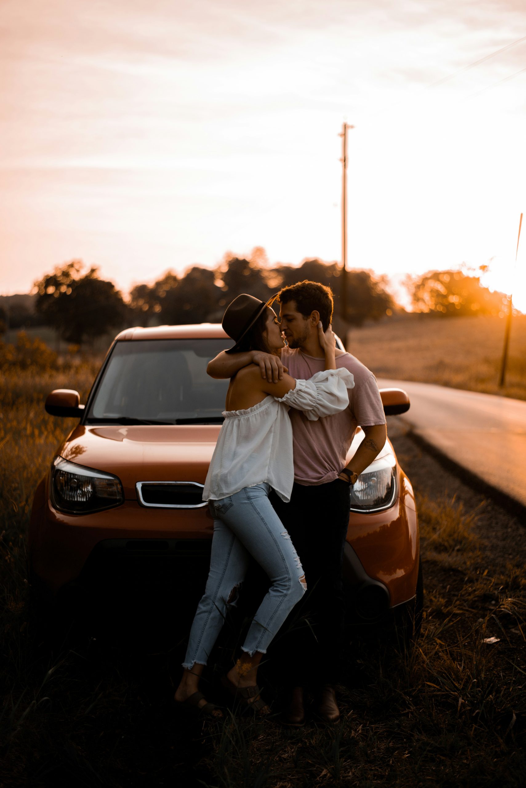 Engaged Alabama couple embracing during golden hour