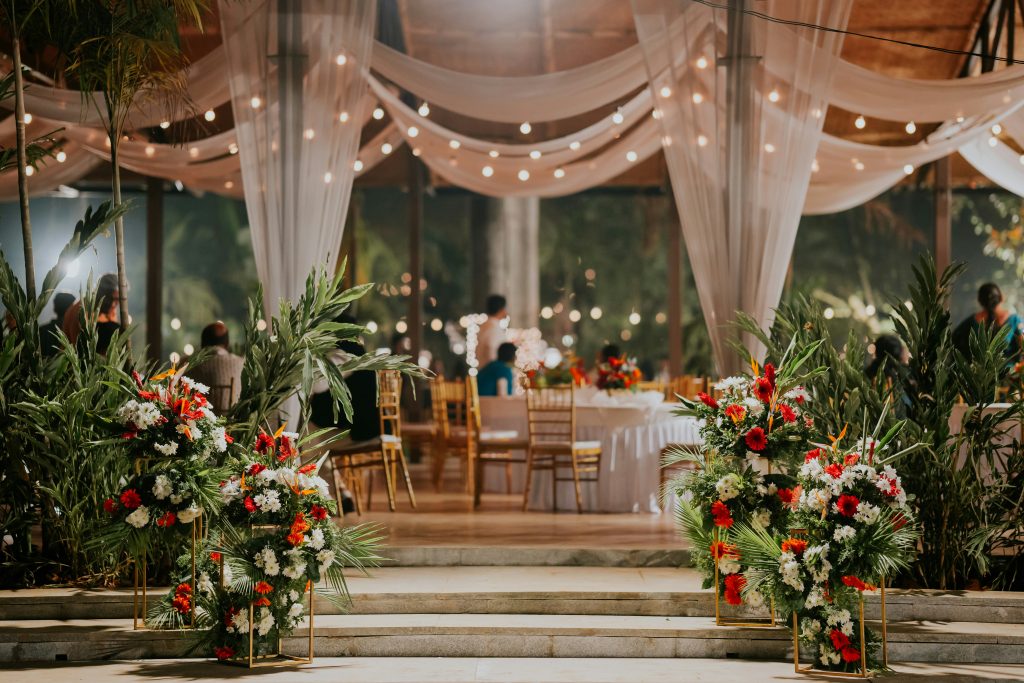A gorgeous wedding location decorated with flowers and event details, set on a sunny day and prepared for a memorable celebration