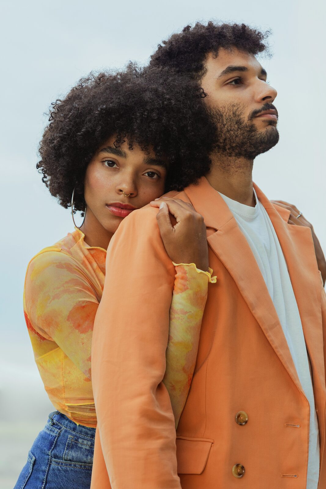 Married couple in coordinated outfits in an editorial portrait