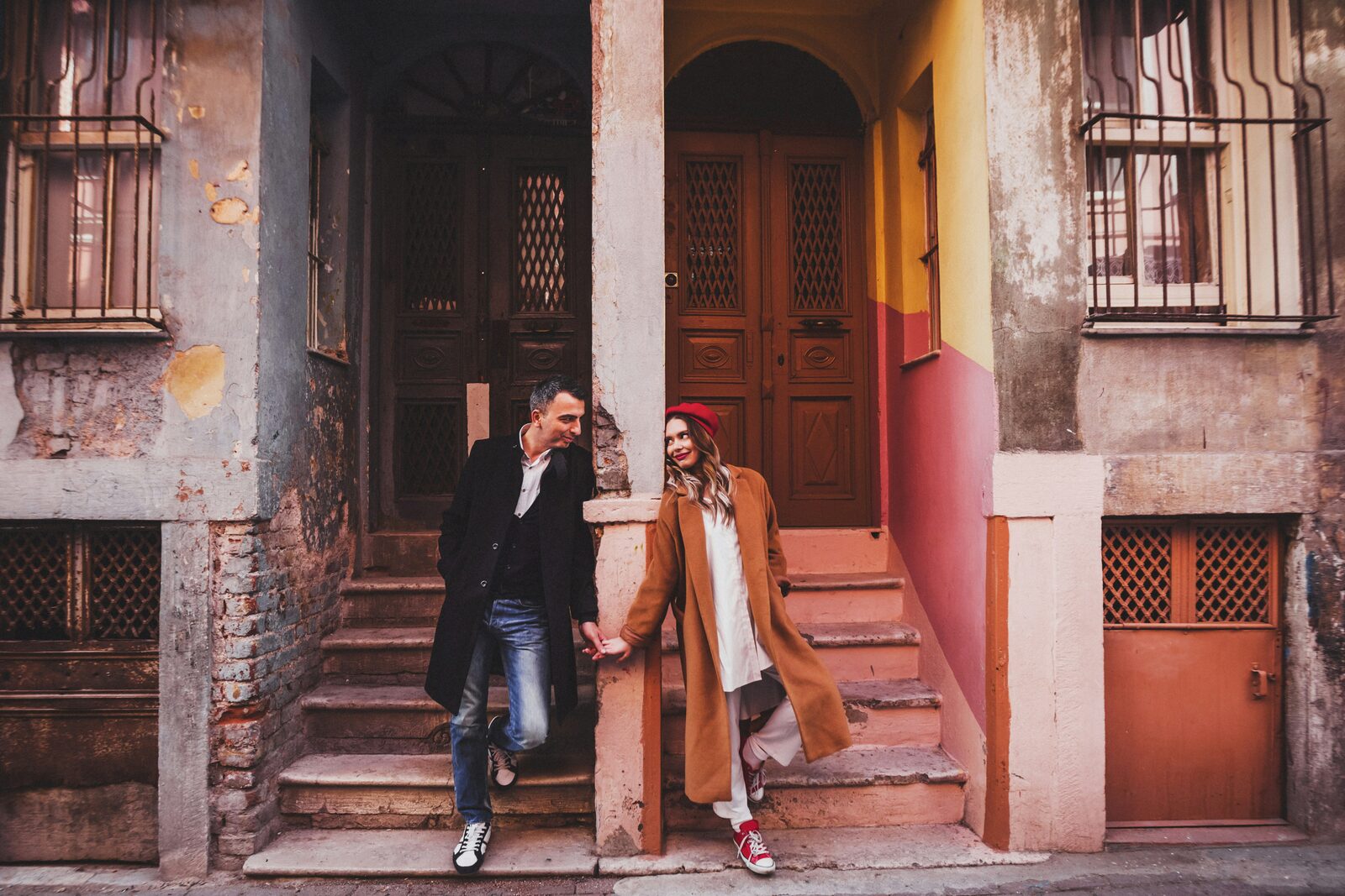 Pennsylvania couple holding hands on a historic brick street, protected with a HelloPrenup prenuptial agreement