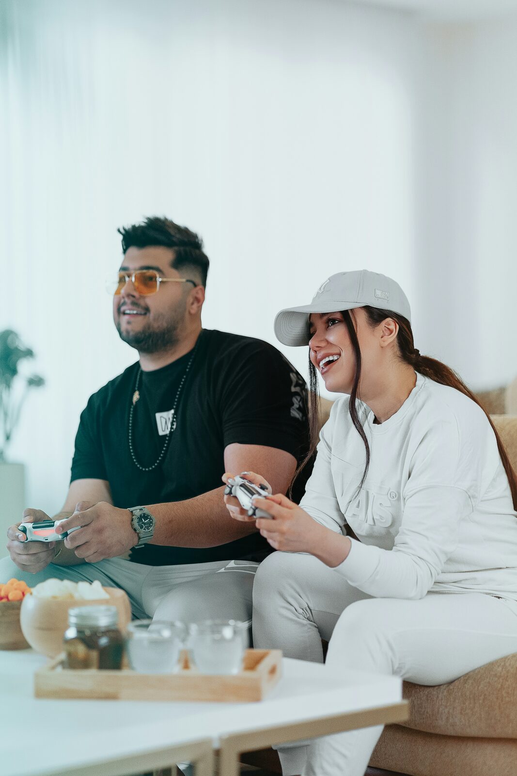 Oklahoma couple laughing on the couch at home after a stress-free prenup process